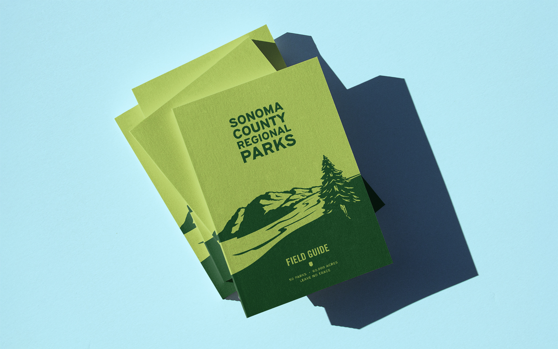 a stack of field guide notebooks for Sonoma County Regional Parks